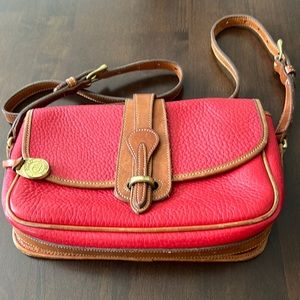 Vintage Dooney and Bourke red pebble, leather with tan trim and gold buckles